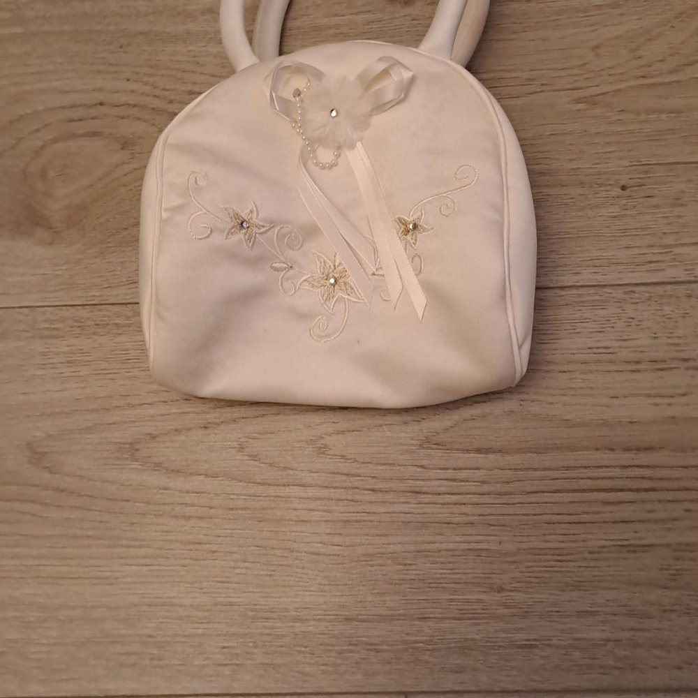 Small satin bag comes with a small satin bow and flower